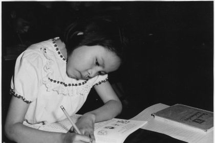 A person concentrating on work at a tidy desk