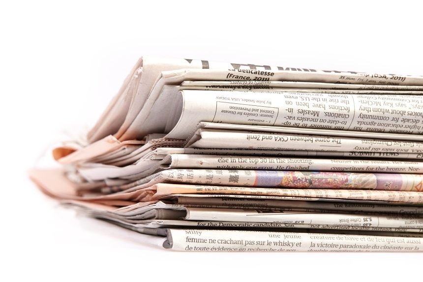 A person reading the news on a tablet